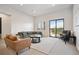 Spacious basement Gathering room with comfortable seating at 3907 Piney Grove St, Evergreen, CO 80439