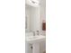 Elegant bathroom with pedestal sink and brass fixtures at 3907 Piney Grove St, Evergreen, CO 80439