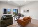 Comfortable basement lounge with couches and large windows at 3907 Piney Grove St, Evergreen, CO 80439