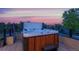 Relaxing hot tub on a rooftop deck with sunset views at 5123 Quaker St, Golden, CO 80403