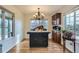 Bright dining room with hardwood floors and built-in cabinetry at 2551 S Flanders Ct, Aurora, CO 80013