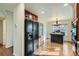 Kitchen features wood cabinets, stainless steel appliances, and a breakfast bar at 2551 S Flanders Ct, Aurora, CO 80013