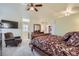 Main bedroom with ensuite bathroom access and sitting area at 2551 S Flanders Ct, Aurora, CO 80013