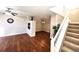 Living room with hardwood floors, fireplace, and staircase at 3747 Windriver Trl, Castle Rock, CO 80109