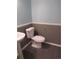 Half bathroom with modern fixtures and two-toned walls at 137 S Syracuse St, Denver, CO 80230