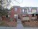 Brick townhouse with front yard and walkway at 137 S Syracuse St, Denver, CO 80230