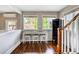 Bright breakfast nook features a built-in table and three white stools at 1281 S High St, Denver, CO 80210