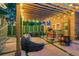 Covered patio with outdoor dining area and comfortable seating, ideal for relaxing evenings at 1281 S High St, Denver, CO 80210