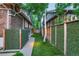 Landscaped backyard with artificial turf and privacy hedges at 1281 S High St, Denver, CO 80210