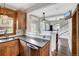 Kitchen with stainless steel appliances and dark wood cabinets at 1281 S High St, Denver, CO 80210
