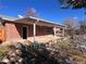 Brick home exterior with covered patio at 12226 E Ohio Ave, Aurora, CO 80012