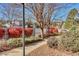 Paved walkway through a landscaped area with trees and shrubs at 17620 E Loyola Dr # 1712R, Aurora, CO 80013