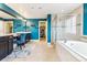 Elegant bathroom with a soaking tub, double vanity, and walk-in shower at 8551 Orchard Way, Arvada, CO 80007