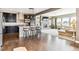 Open kitchen boasts dark cabinetry, granite counters & breakfast bar at 8551 Orchard Way, Arvada, CO 80007