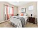 Cozy bedroom with neutral decor and ample window light at 8551 Orchard Way, Arvada, CO 80007