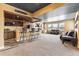 Basement bar with copper sink, granite countertops, and ample cabinetry at 8551 Orchard Way, Arvada, CO 80007