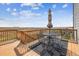 Deck with table and chairs offering scenic views at 8551 Orchard Way, Arvada, CO 80007