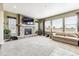 Spacious living room with stone fireplace and ample natural light at 8551 Orchard Way, Arvada, CO 80007