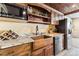 Well-equipped basement bar with microwave, sink, and wine storage at 8551 Orchard Way, Arvada, CO 80007