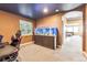 Basement office space with a large fish tank and comfortable seating at 8551 Orchard Way, Arvada, CO 80007