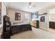Well-lit bedroom with a full-size bed and dresser at 8551 Orchard Way, Arvada, CO 80007