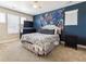 Bright bedroom featuring a comfortable bed and ample closet space at 8551 Orchard Way, Arvada, CO 80007