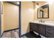 Basement bathroom with a modern vanity and a spacious layout at 8551 Orchard Way, Arvada, CO 80007