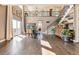Bright dining area with hardwood floors, high ceilings, and a view at 8551 Orchard Way, Arvada, CO 80007