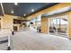 Finished basement with wet bar, game tables, and plenty of space for entertaining at 8551 Orchard Way, Arvada, CO 80007