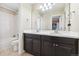 Shared bathroom with double sinks and a large mirror at 8551 Orchard Way, Arvada, CO 80007