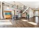 Spacious living room with hardwood floors, high ceilings, and a staircase at 8551 Orchard Way, Arvada, CO 80007