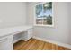 Bright home office features built-in desk and hardwood floors at 779 Kohlor Dr, Lafayette, CO 80026