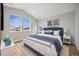 Bedroom with wood floors, large windows, and a view at 779 Kohlor Dr, Lafayette, CO 80026
