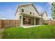 Spacious backyard with a large patio and grassy lawn at 779 Kohlor Dr, Lafayette, CO 80026