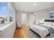 Bedroom with wood floors, large window, and sitting area at 779 Kohlor Dr, Lafayette, CO 80026