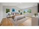Spacious bedroom with wood floors and large windows offering ample natural light at 779 Kohlor Dr, Lafayette, CO 80026