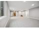 Spacious and bright basement with large windows and neutral carpeting at 779 Kohlor Dr, Lafayette, CO 80026