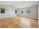 Spacious bedroom with hardwood floors and large windows at 779 Kohlor Dr, Lafayette, CO 80026