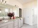 Elegant bathroom with double vanity, granite countertop, and a large shower at 3958 Breakcamp Ct, Castle Rock, CO 80108