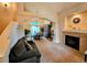 Living room with vaulted ceiling, fireplace, and view to the dining room at 20175 Edinborough Pl, Parker, CO 80138