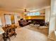 Spacious living room featuring a large sectional sofa and a coffee table at 20175 Edinborough Pl, Parker, CO 80138