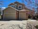 Two-story house with a double garage and landscaped yard at 20175 Edinborough Pl, Parker, CO 80138