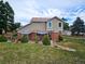 Landscaped backyard with patio and shade sails at 20175 Edinborough Pl, Parker, CO 80138