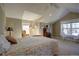 Bright bedroom featuring a comfortable bed, window seating, and a large dresser at 6067 S Hill St, Littleton, CO 80120