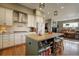 Bright kitchen with white cabinets, stainless steel appliances, and an island with seating at 6067 S Hill St, Littleton, CO 80120