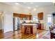 Modern kitchen with stainless steel appliances and an island at 15827 E 107Th Way, Commerce City, CO 80022