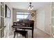 Bright music room featuring a grand piano and built in shelving at 15827 E 107Th Way, Commerce City, CO 80022