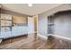 Bedroom with hardwood floors, built-in shelving, and walk-in closet at 1288 S Emerson St, Denver, CO 80210