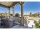 Inviting front porch with comfortable seating and planters at 8741 S Ukraine Ct, Aurora, CO 80016