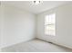 Spacious bedroom with neutral carpeting and a window at 4469 Soapberry Pl, Castle Rock, CO 80108